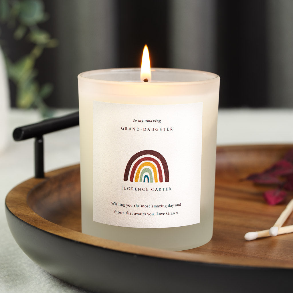Boho rainbow illustration above the name on a personalised wedding candle label