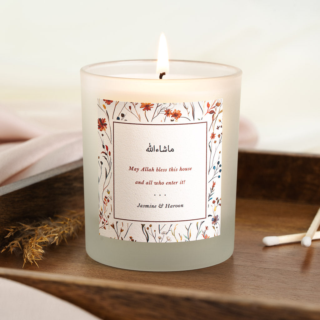 Personalised Islamic new home candle with a red-bordered box holding Arabic script