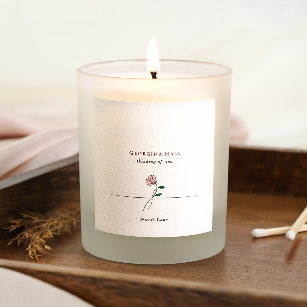 Rose illustration centred beneath a thinking of you heading on a personalised memorial candle
