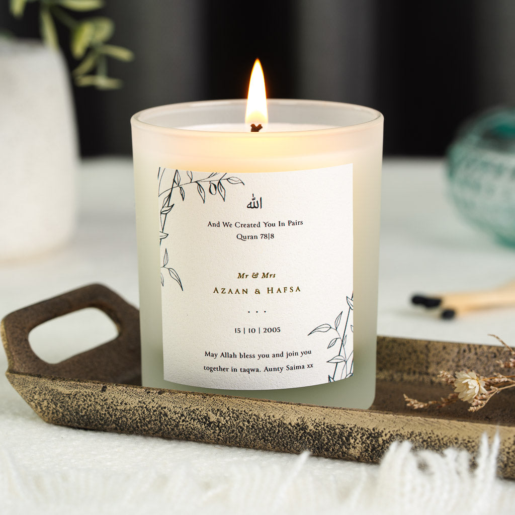Arabic calligraphy above Surah An-Naba in gold-toned script on a personalised nikah candle