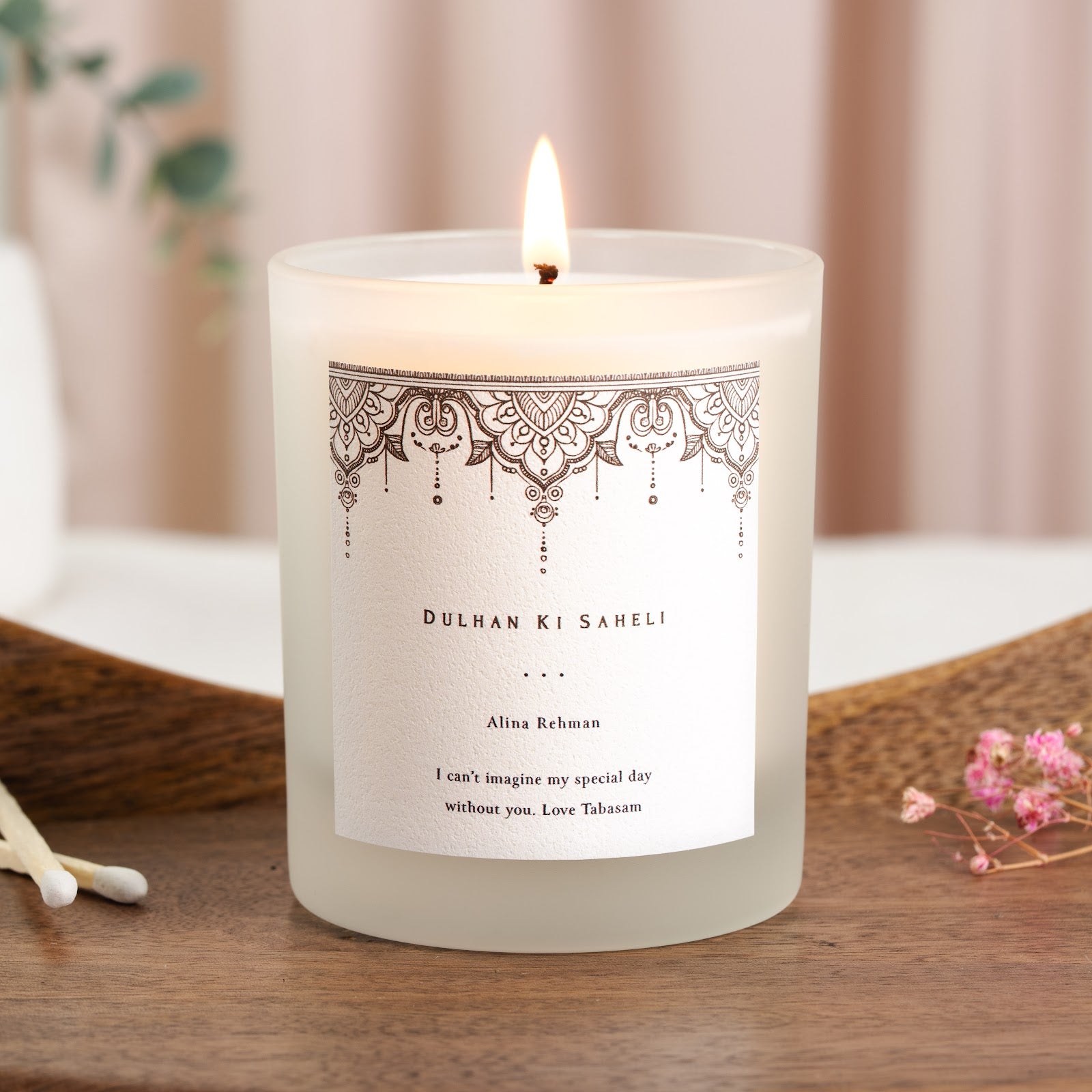 Mandala pattern in dark brown ink across the top of a personalised Dulhan Ki Saheli candle