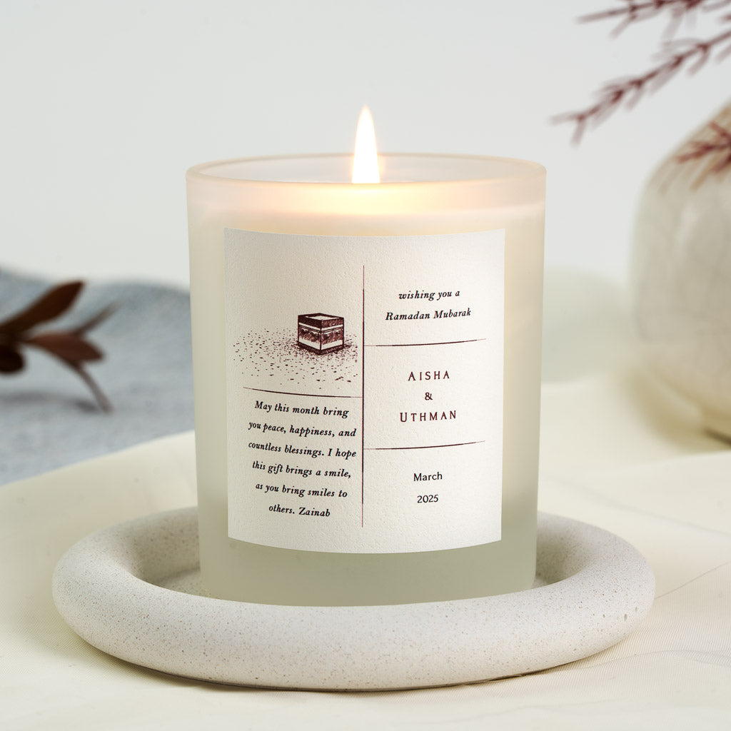 Small maroon Kaaba sketch in a four-part grid layout on a personalised Ramadan candle