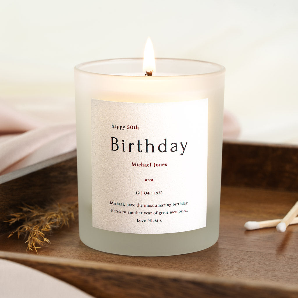 Personalised birthday candle with the milestone above birthday in large serif type