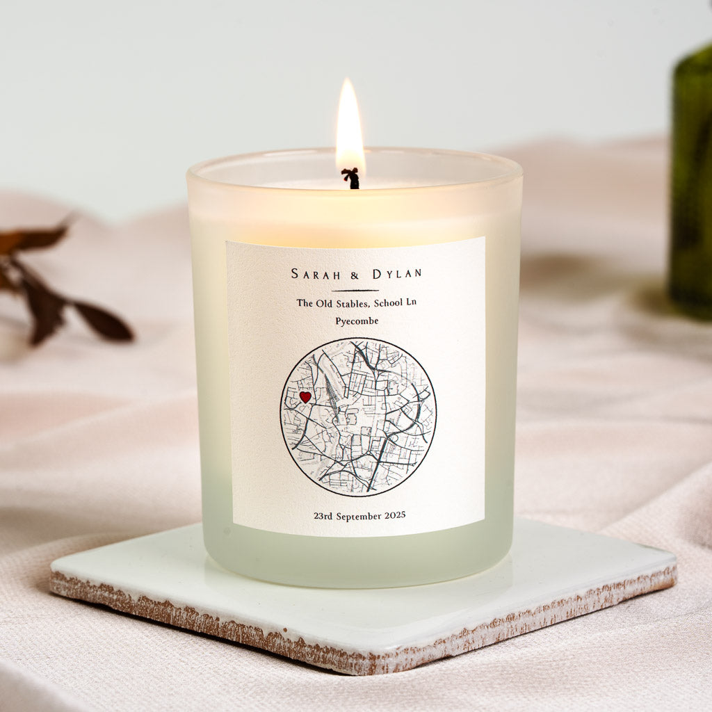 Circular street map with the new home pinned in red on a personalised new home candle