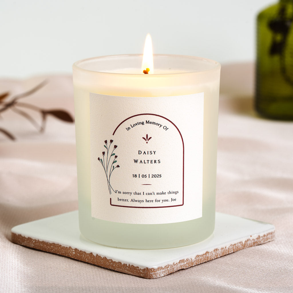 Arch framing the name beneath a remembrance heading on a personalised memorial candle