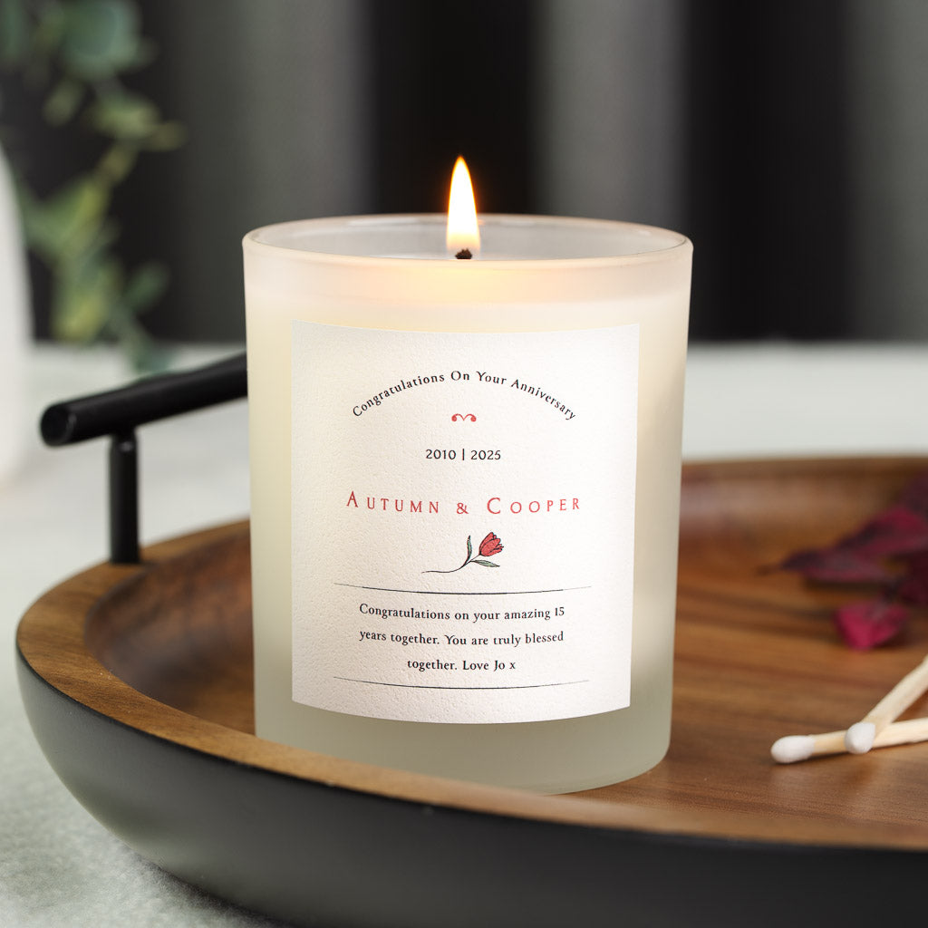 Personalised anniversary candle with an arched heading above a tulip illustration