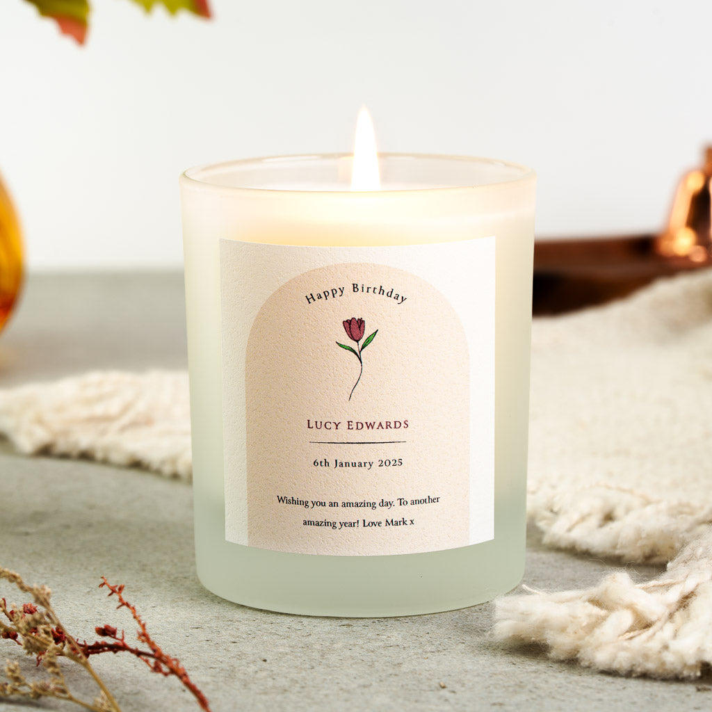 Personalised birthday candle with a tulip illustration set inside an arched panel