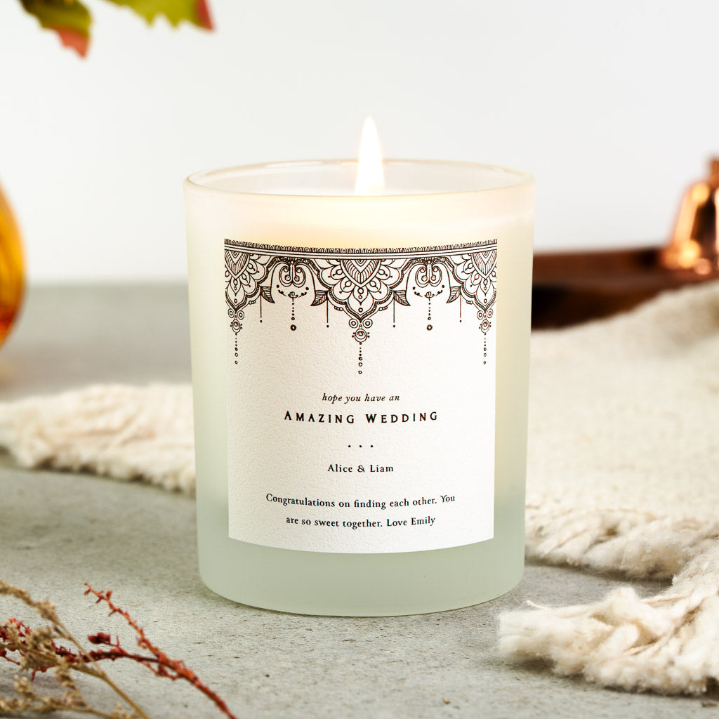 Personalised wedding candle with an intricate hanging lace border above a centred heading