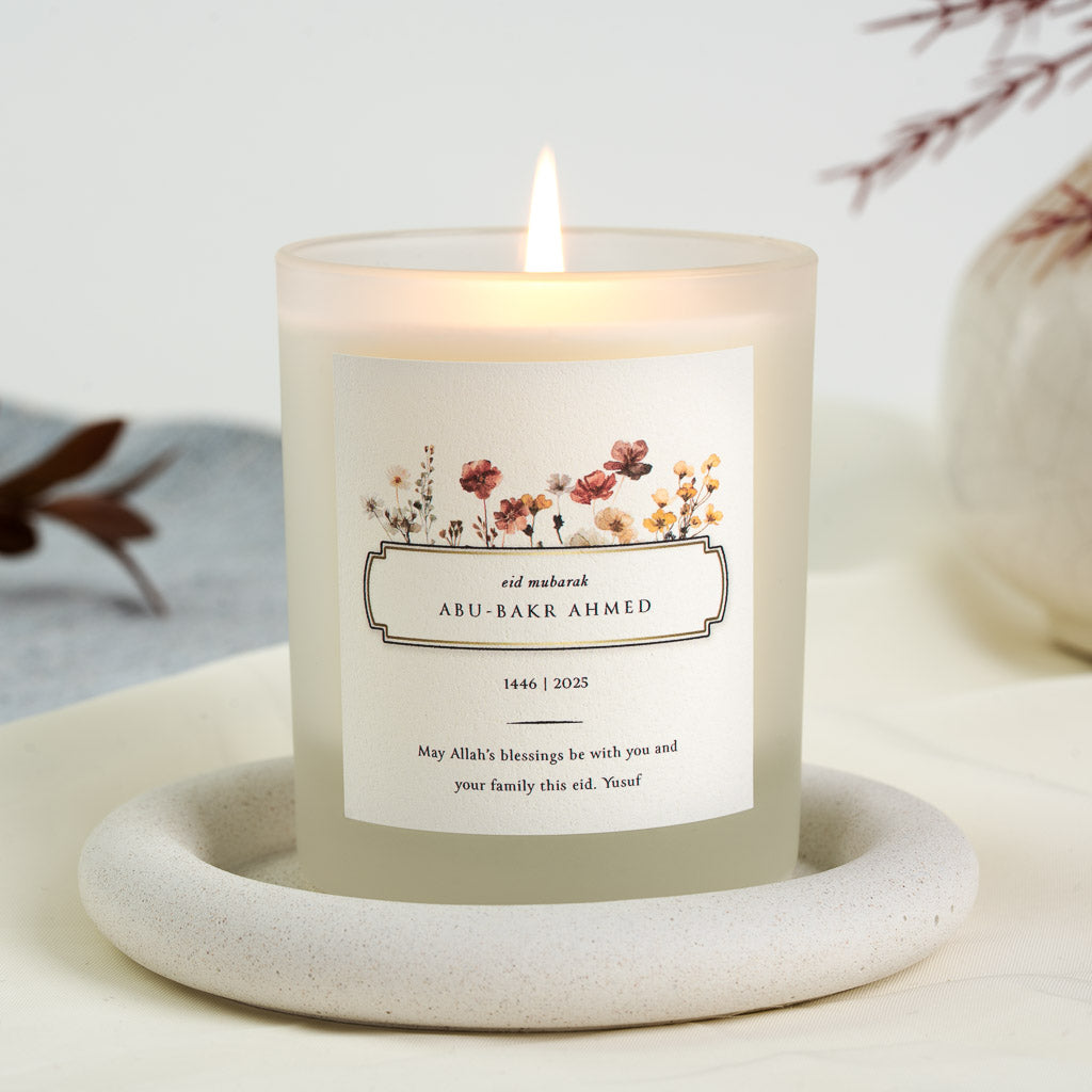 Personalised Eid candle with watercolour wildflowers above a slim double-lined box