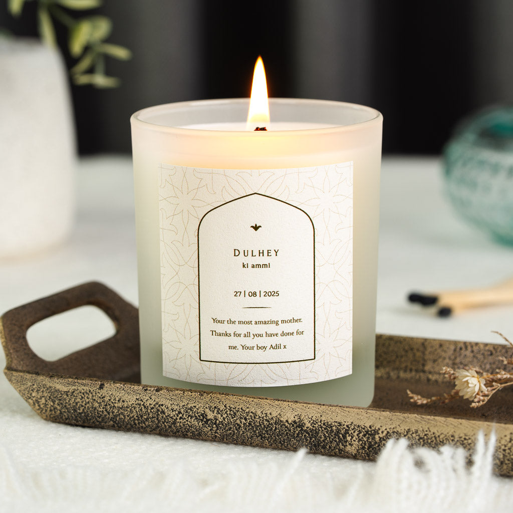 Personalised wedding candle with a white arch on a subtly patterned Dulhey Ki Ammi label