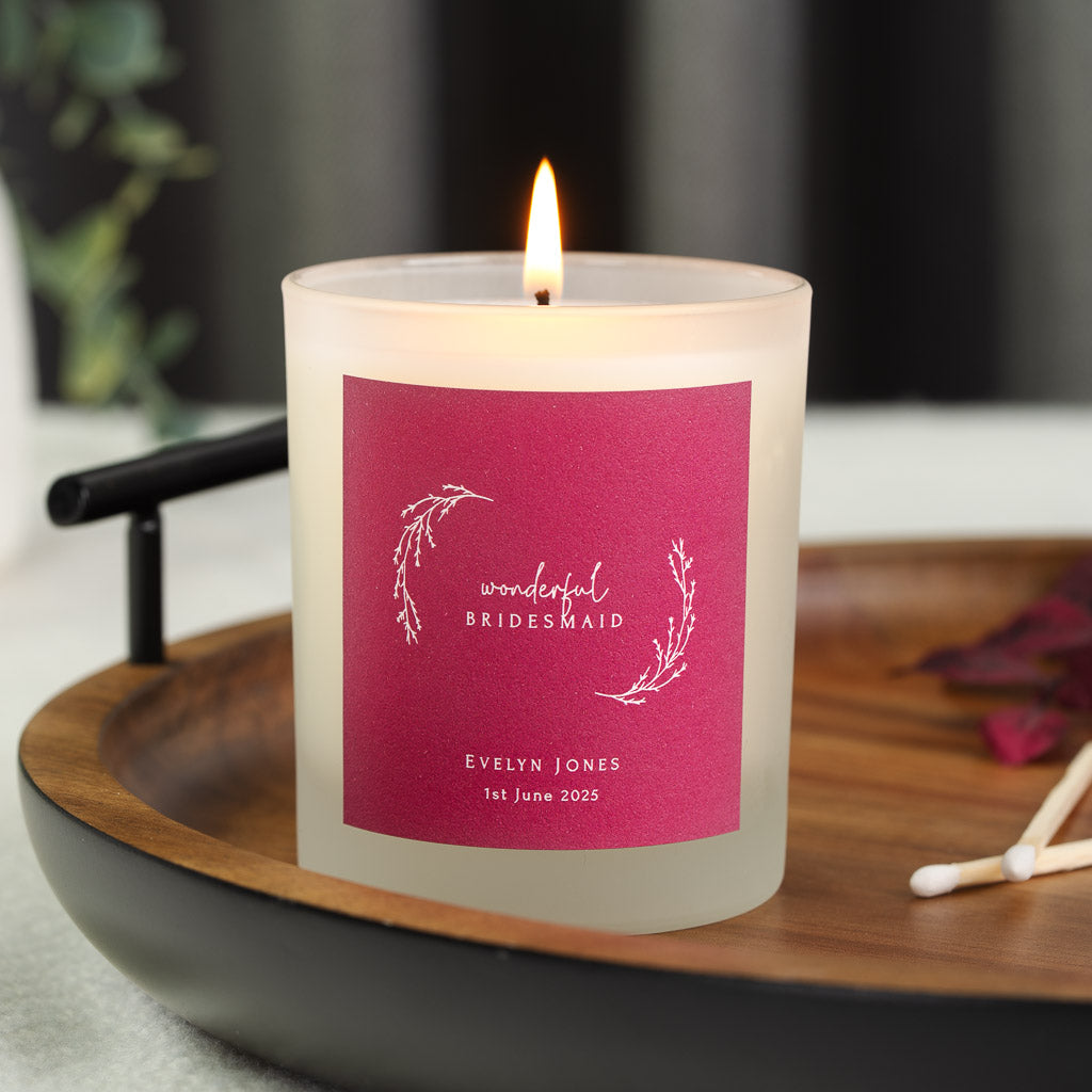 Fine botanical wreath in white on a rich berry pink personalised bridesmaid candle label
