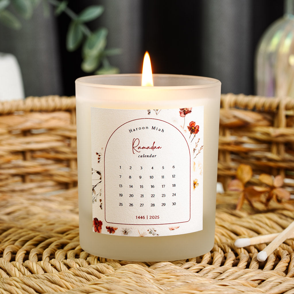 Personalised Ramadan candle with a dark red arch framing a grid of the month's days