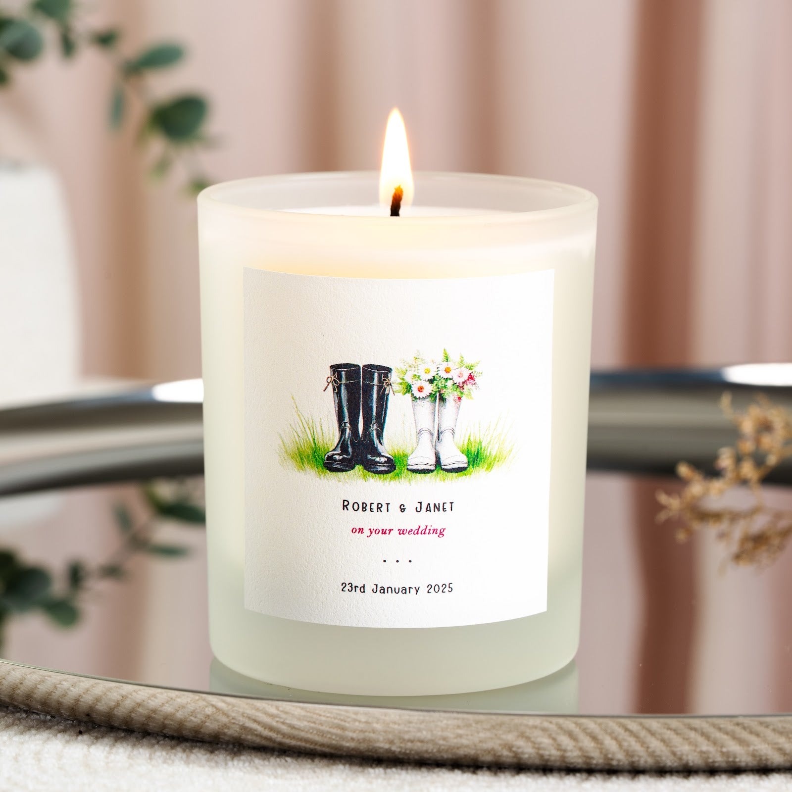 Personalised country wedding candle with his and hers wellies filled with daisies and wildflowers