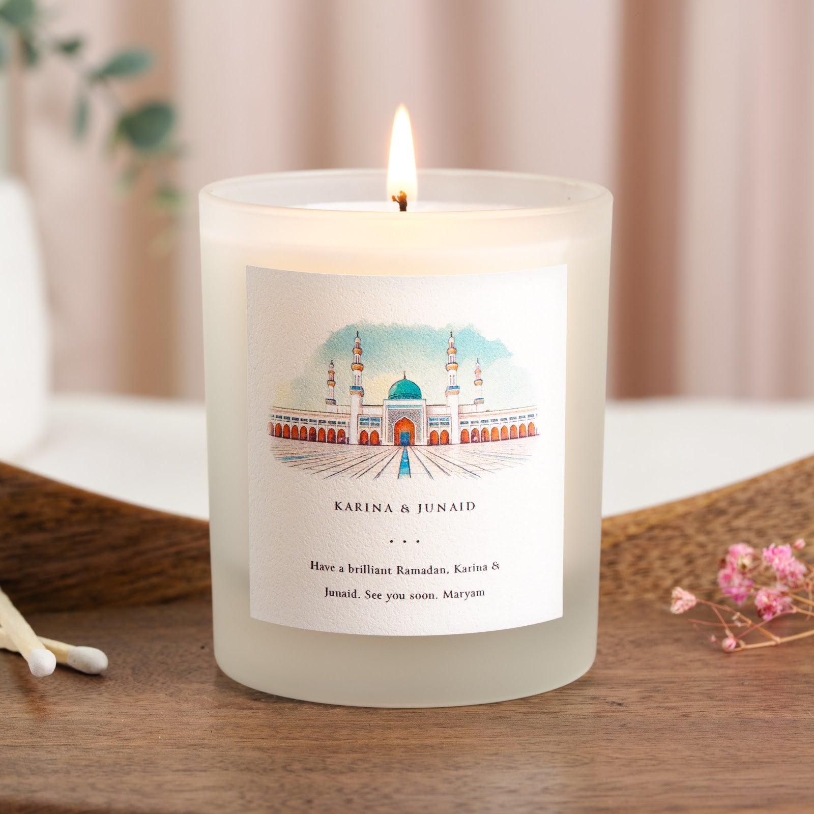 Watercolour mosque with a deep teal dome on a pale blue personalised Ramadan candle