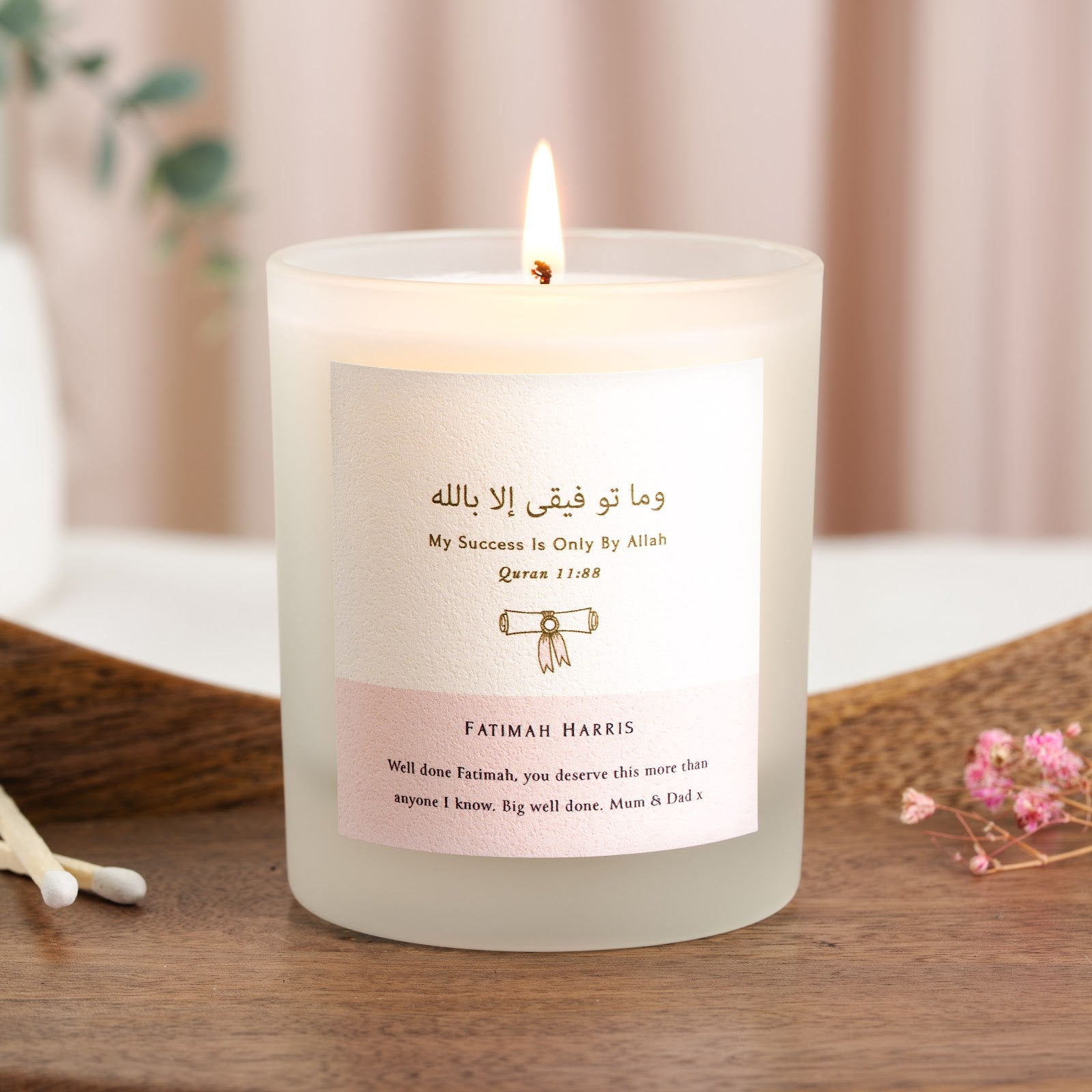 Personalised Islamic graduation candle with Surah Hud in warm gold at the top