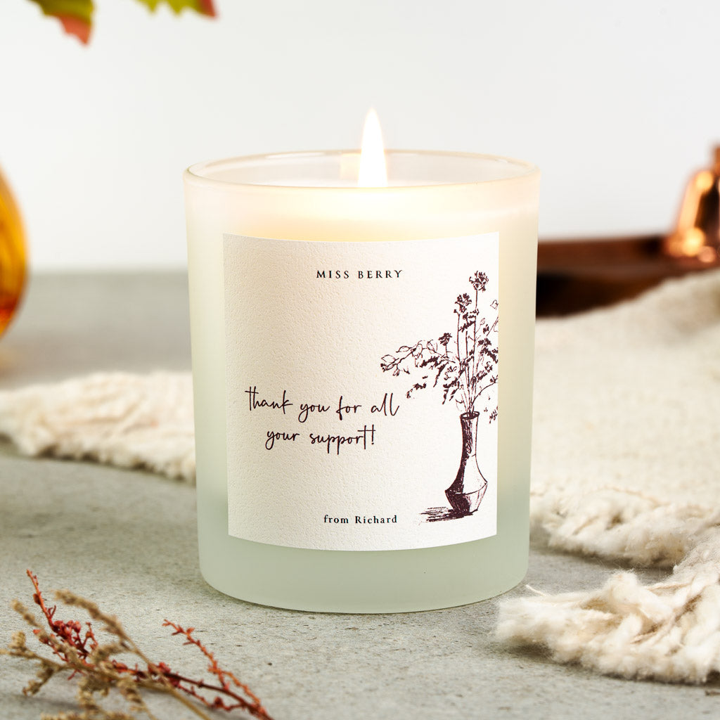 Personalised teacher candle with a hand-drawn vase of foliage beside the name