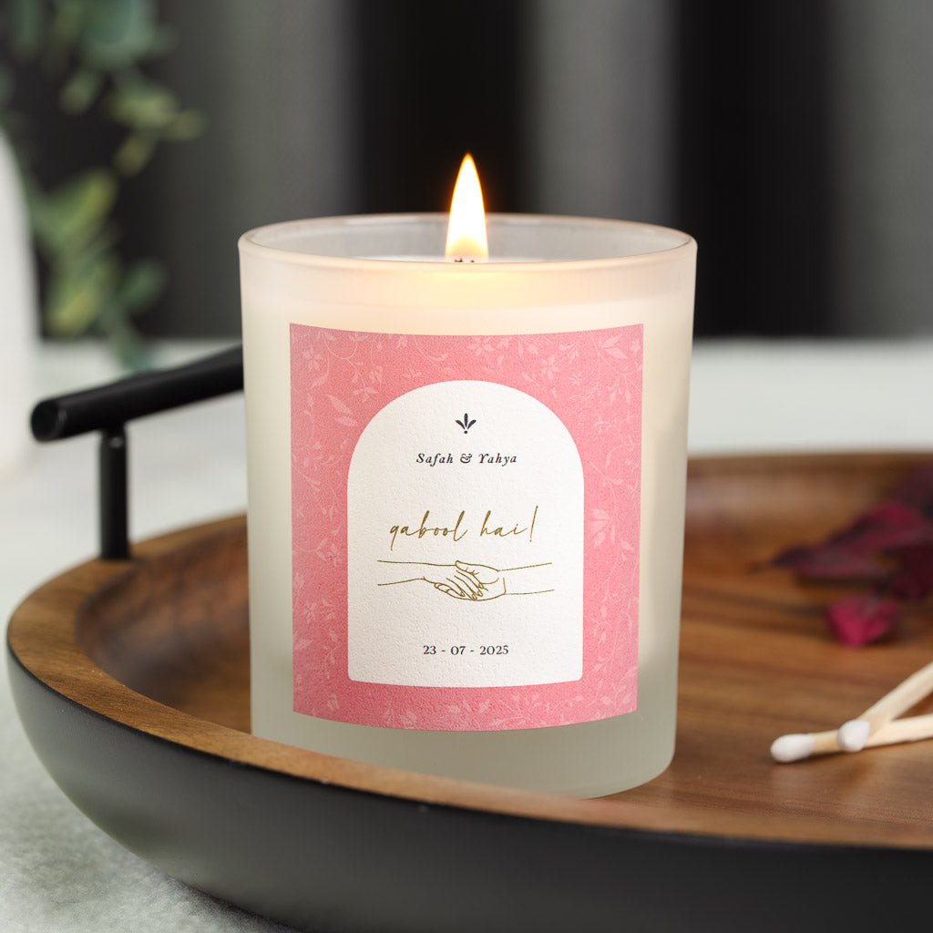 Pale pink floral pattern framing a white arch on a personalised qabool hai candle label