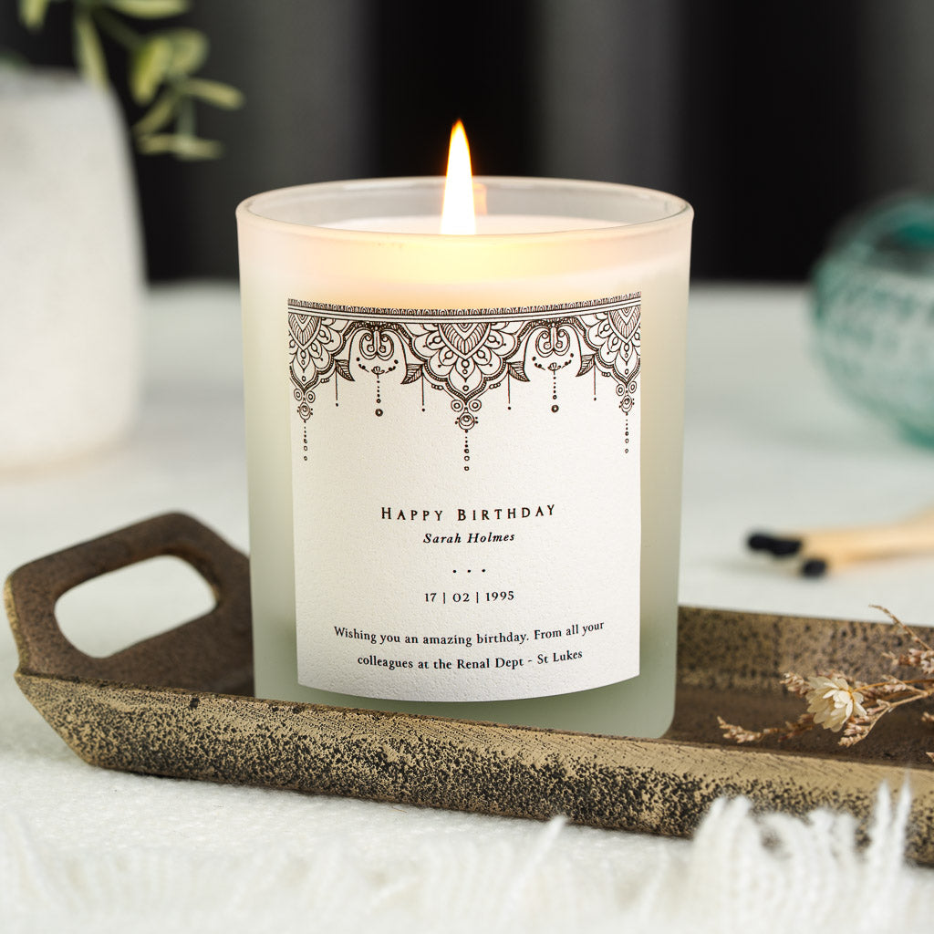 Ornate henna-style border along the top of a personalised birthday candle label