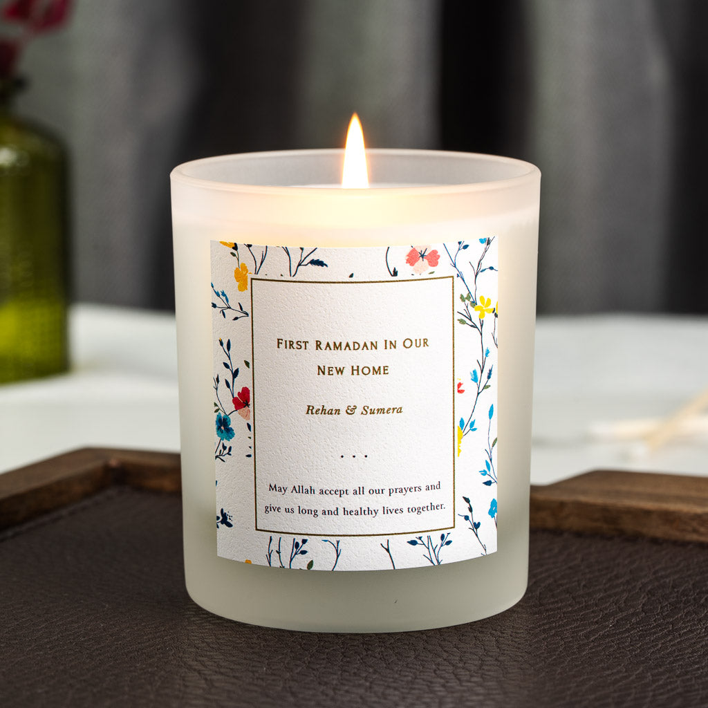 Personalised Ramadan candle with painted wildflowers and butterflies around a gold panel