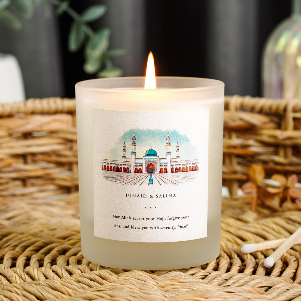 Watercolour mosque above the names in plain serif on a personalised Hajj candle label