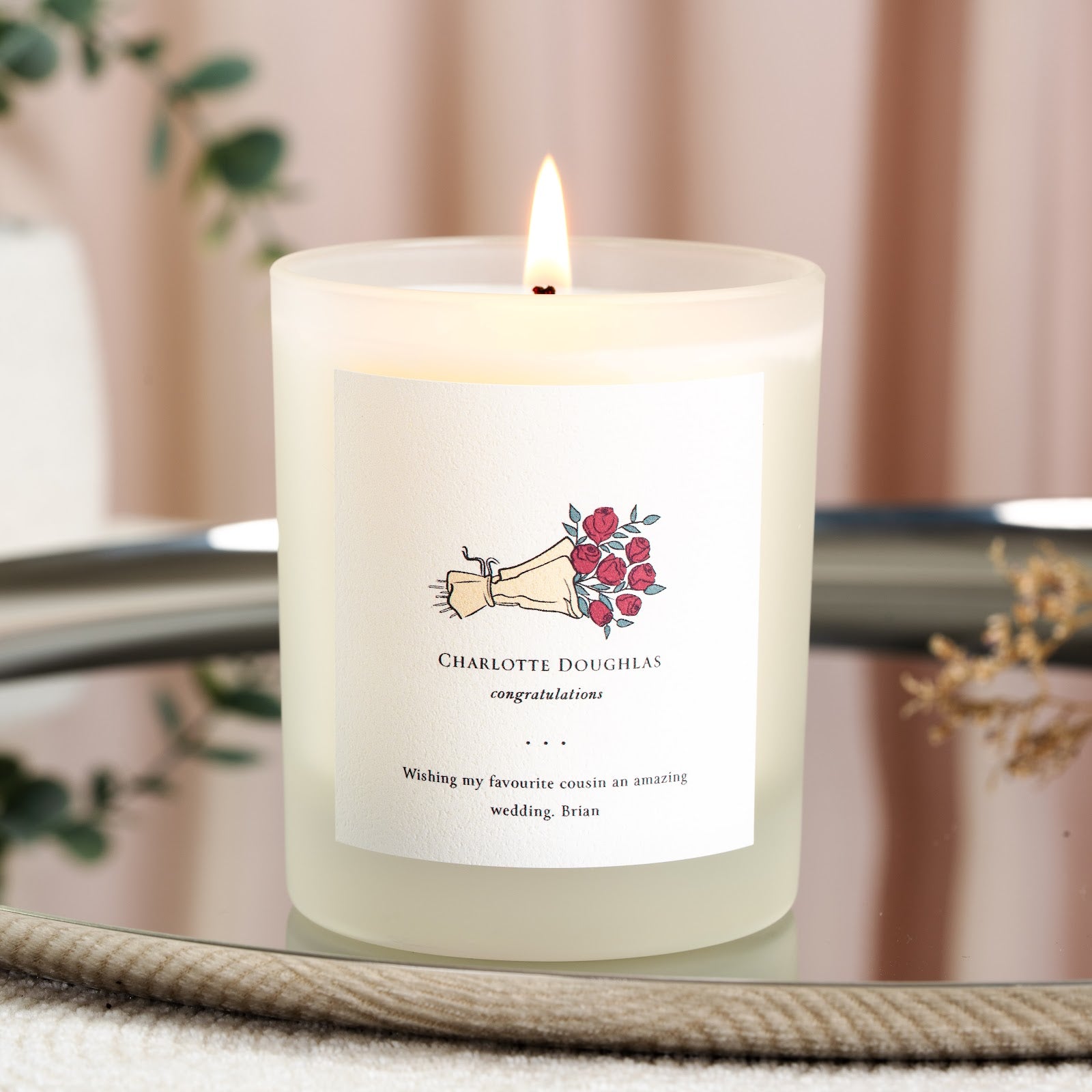 Personalised wedding candle with a red rose bouquet illustration above serif lettering