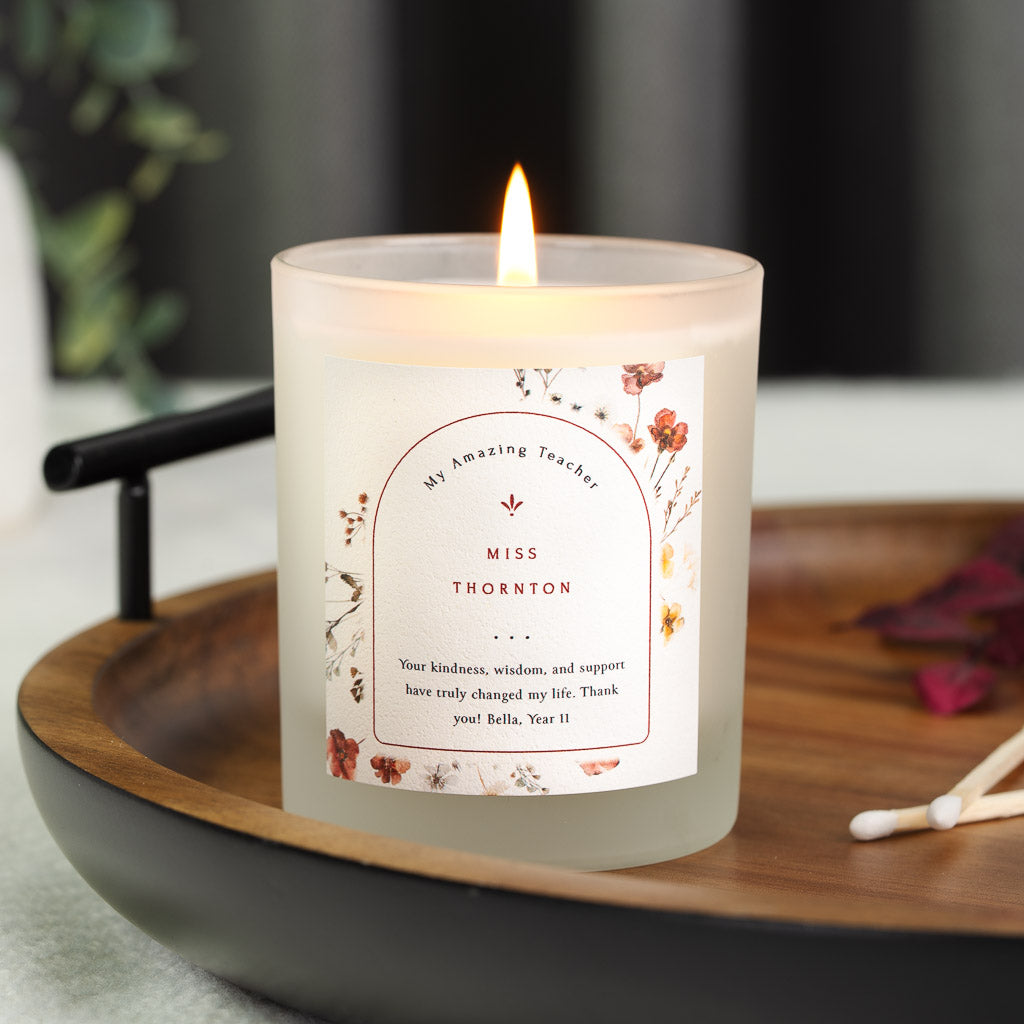 Wildflowers framing an arched outline on a personalised teacher appreciation candle label