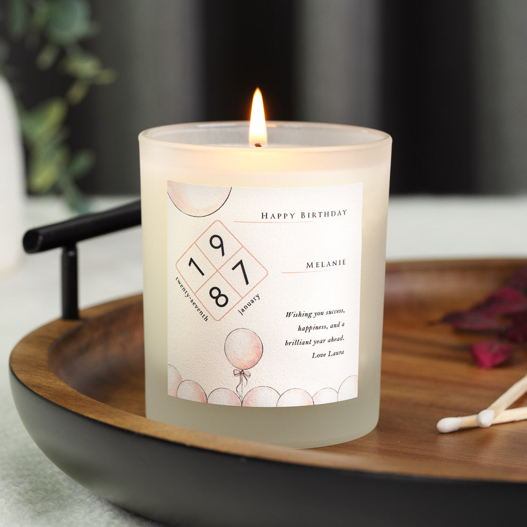 Personalised birthday candle with the date in a diamond framed by corner balloons