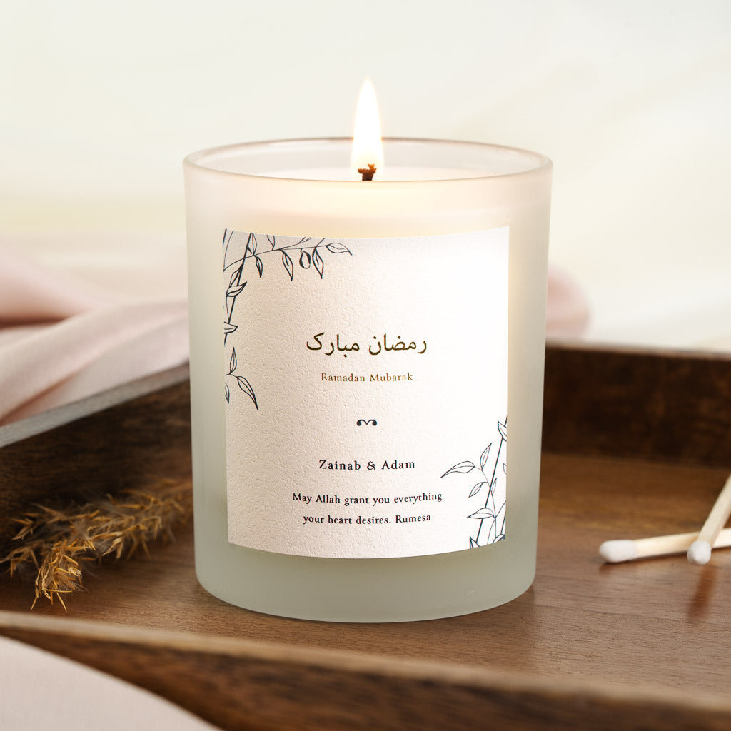 Personalised Ramadan candle with black line-drawn leaves in opposite corners