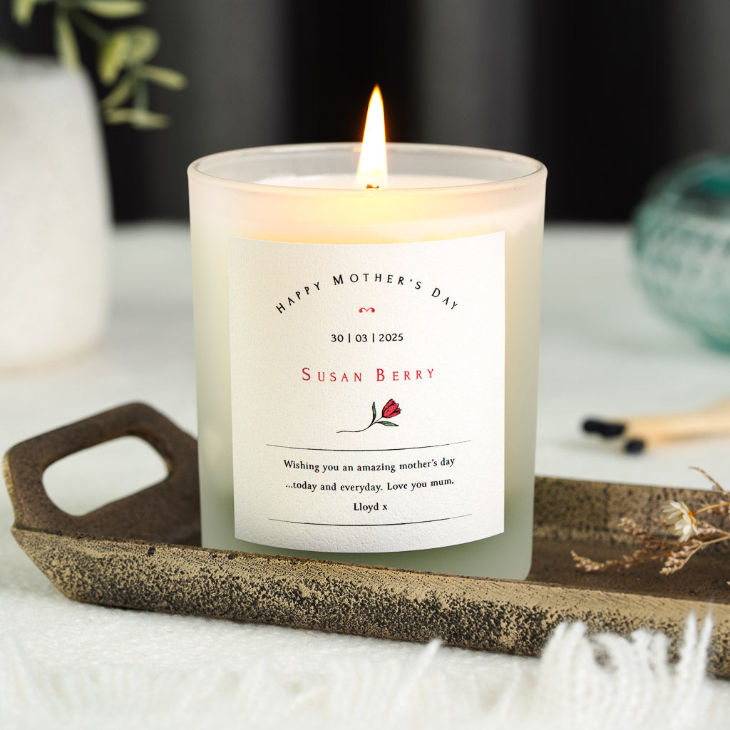 Curved spaced capitals above a tulip illustration on a personalised Mother's Day candle