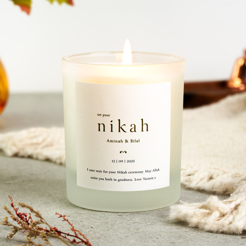 Personalised nikah candle with the word nikah set in large serif capitals