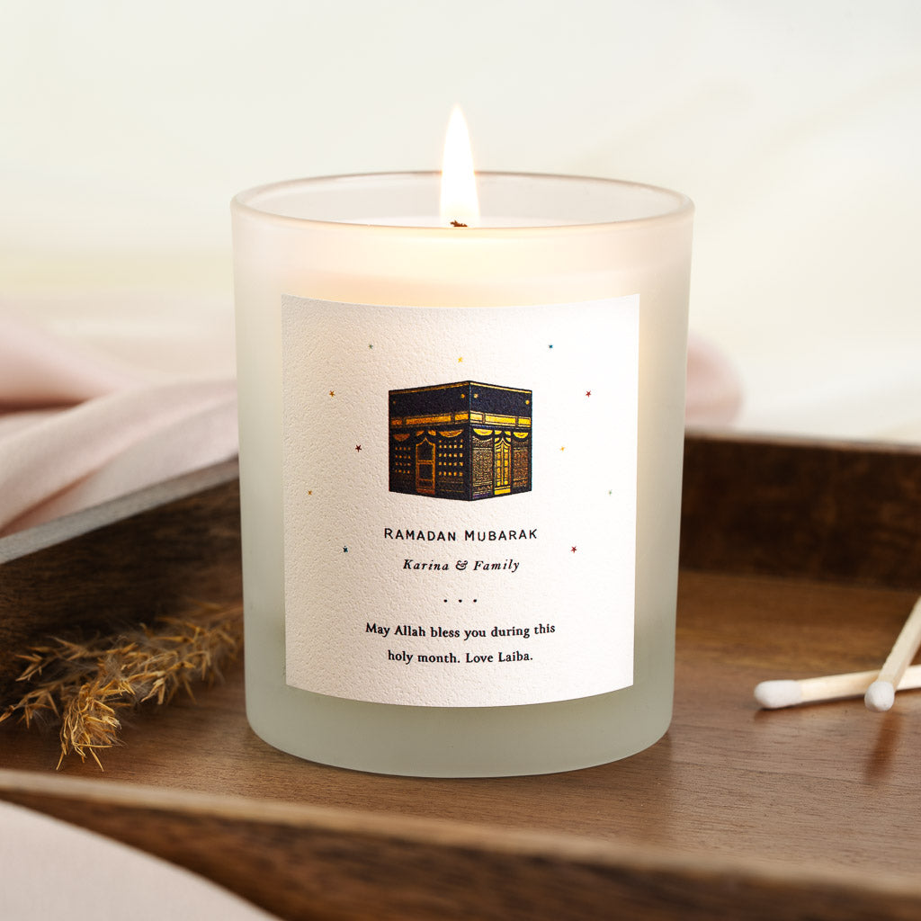 Personalised Ramadan candle with a warm gold and navy Kaaba at the centre