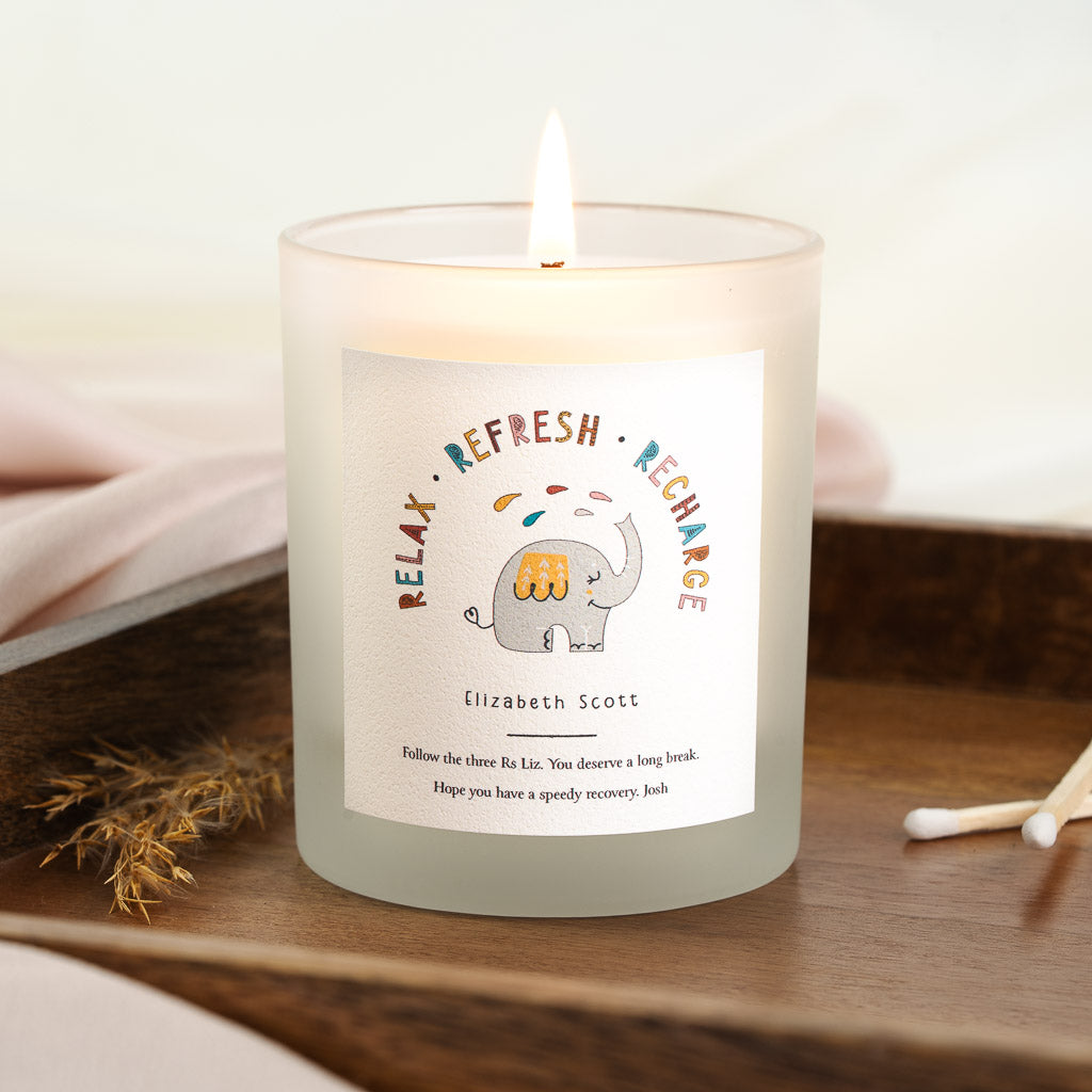 Personalised get well candle with an elephant illustration beneath arched mixed-colour lettering