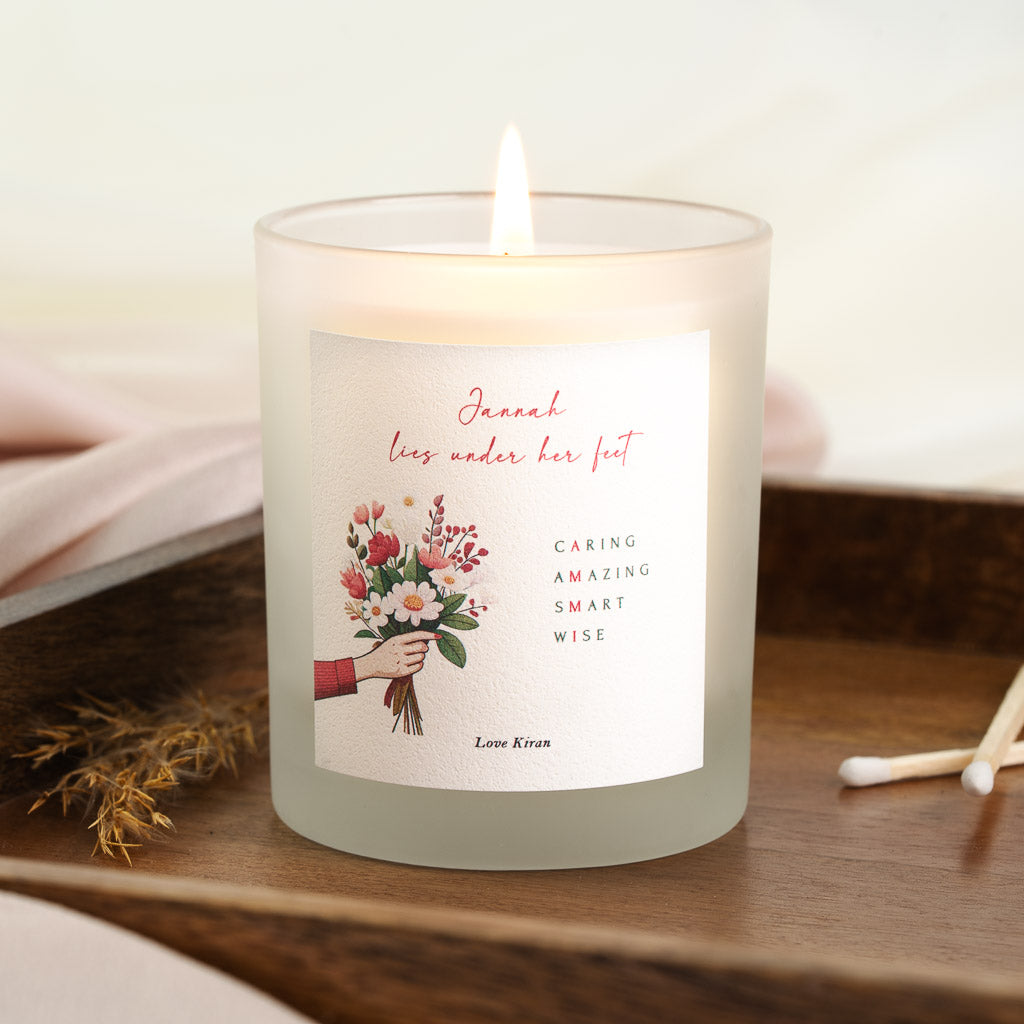Illustrated hand holding pink and white flowers on a personalised Islamic Mother's Day candle