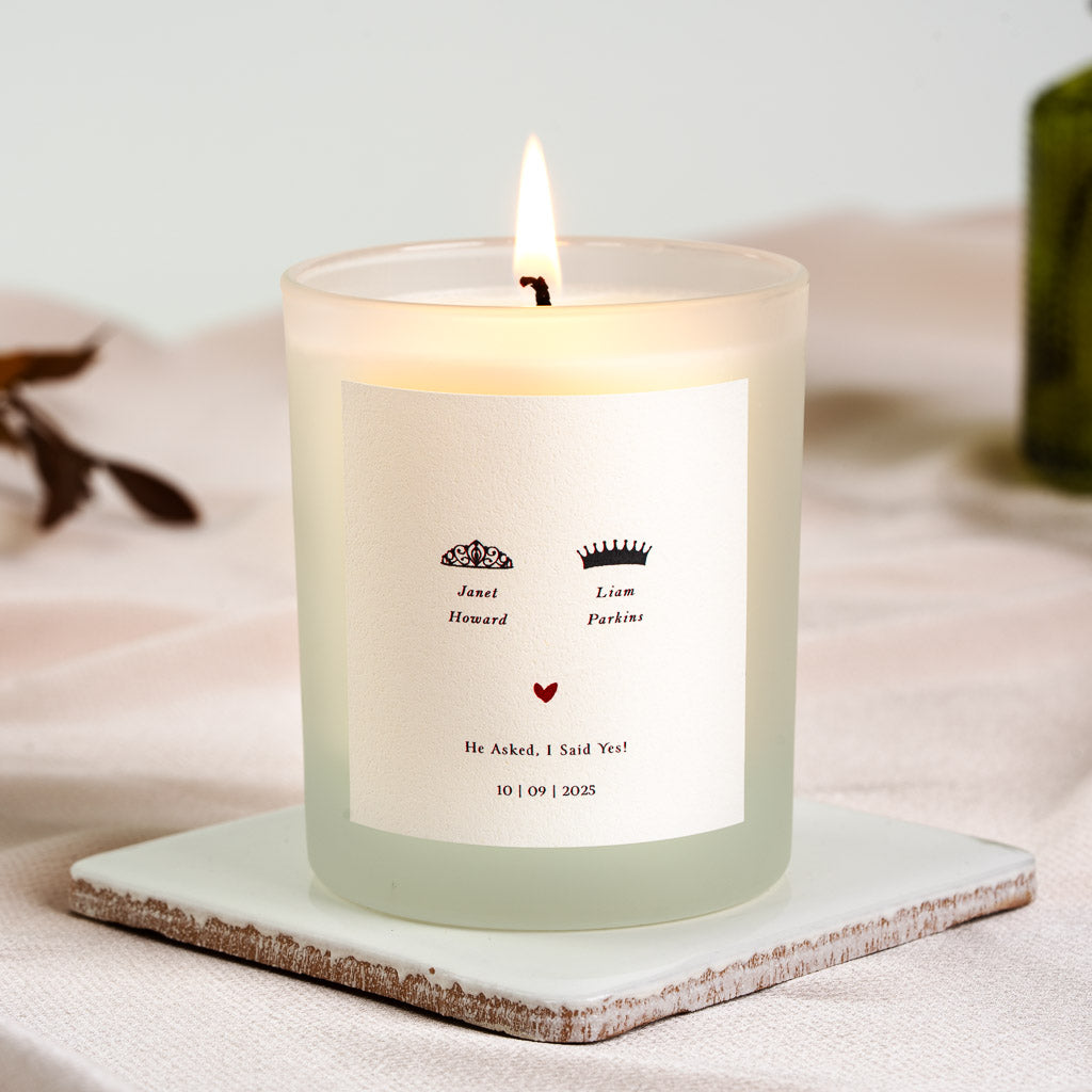 Paired icons above each partner's name on a personalised engagement candle label