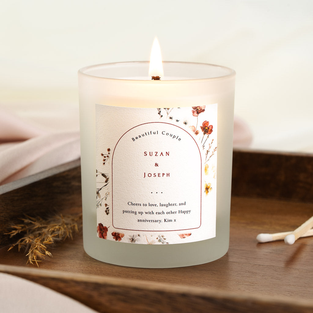 Arched panel above beautiful couple lettering on a personalised anniversary candle label