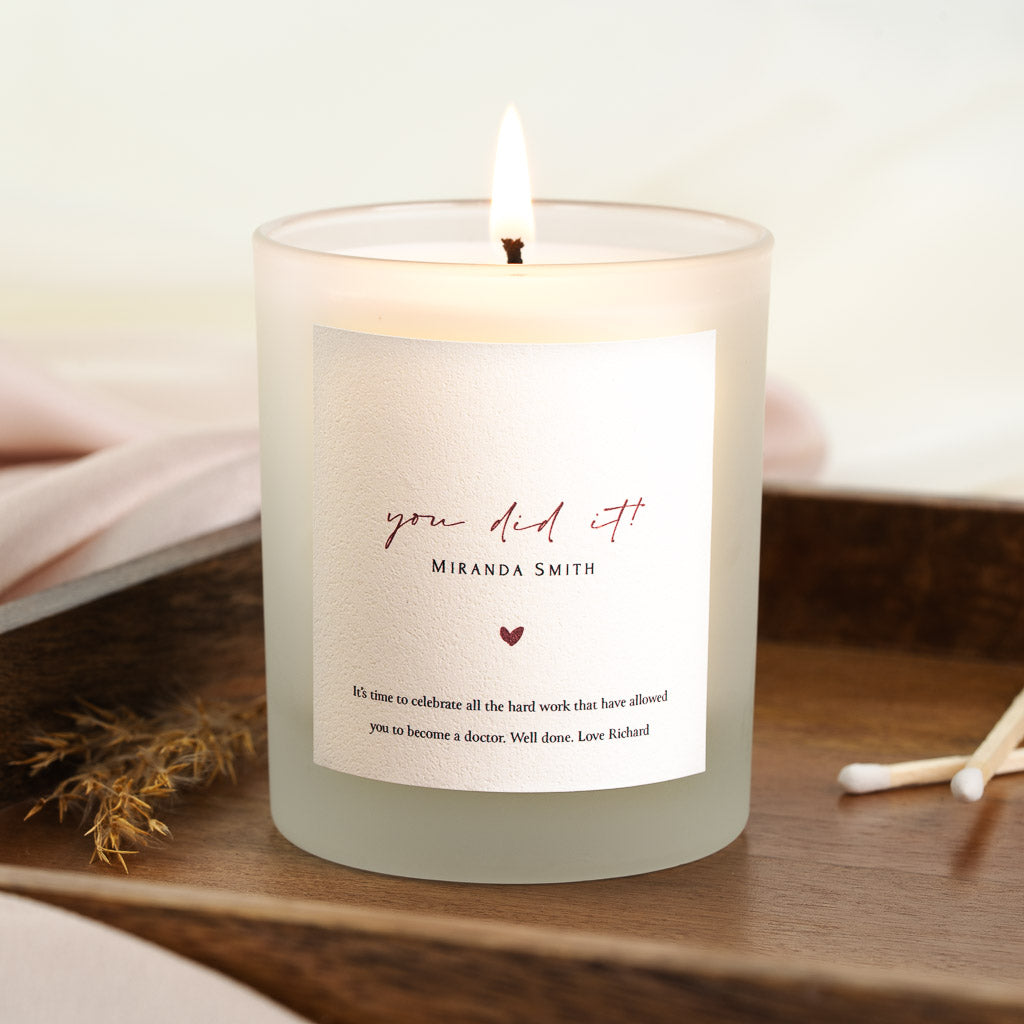 Personalised congratulations candle with red script above a small heart
