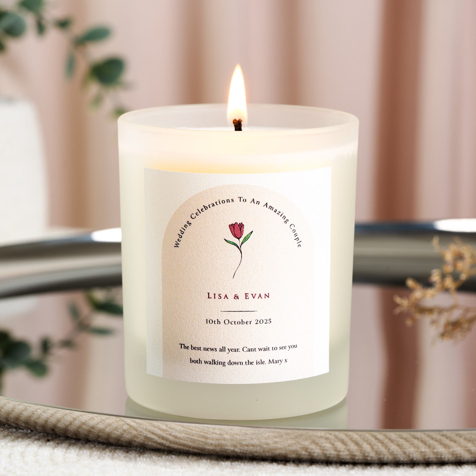 Personalised wedding candle with a pale arch framing a single red tulip