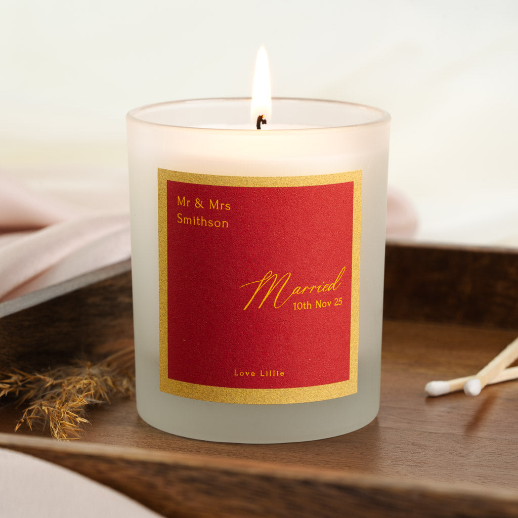 Bold red and gold label with Married in flowing gold script on a personalised wedding candle